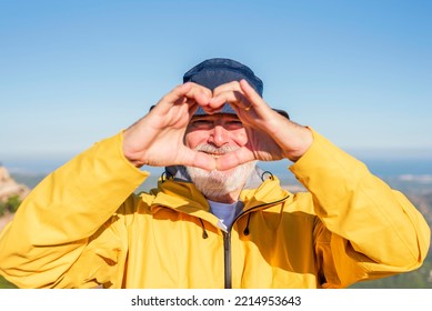 Smiling Elderly Man Making A Heart Shape With Hands - Healthy Lifestyle, Self Love And Active Retirement Concept