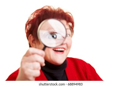 Smiling Elderly Woman Looking Through Magnifying Glass