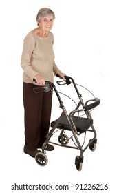 A Smiling Elderly Woman Standing With Her Walker Isolated On White Background