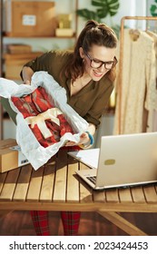 Smiling Elegant 40 Years Old Small Business Owner Woman In The Office Video Chatting On Laptop.