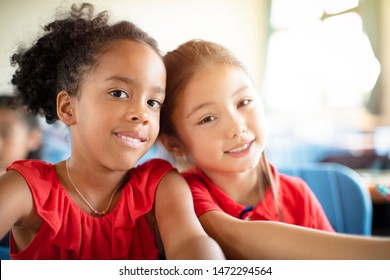 Smiling Elementary School Kids  In Classroom