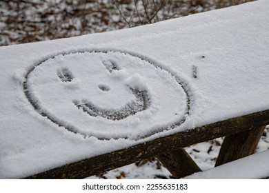 Smiling emoji snow covered