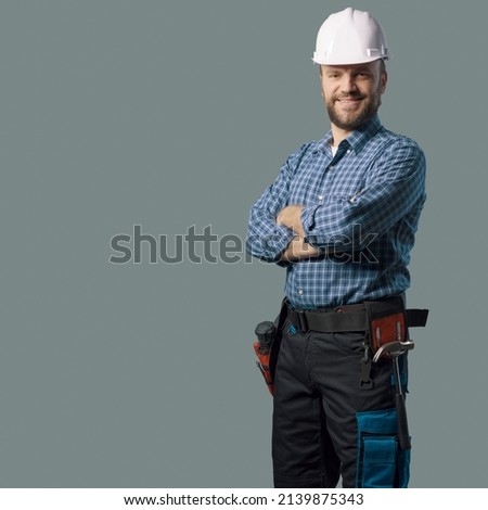 Smiling engineer with safety helmet, home renovation and professional service concept