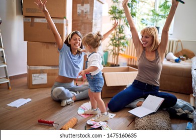 Smiling woman’s enjoying in new house with child girl - Shutterstock ID 1475160635