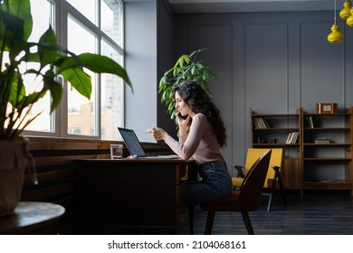 Smiling Entrepreneur Businesswoman Talking On Smartphone With Colleague Discuss Business Project, Financial Report Or Strategy. Cheerful Female Sales Manager Communicating With Client On Cellphone