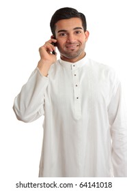 Smiling ethnic business man using phone - in traditional ethnic robe - Kurta - fastened with ruby buttons. The name Kurta is from Urdu & Hindi, & originally Persian (literally, 