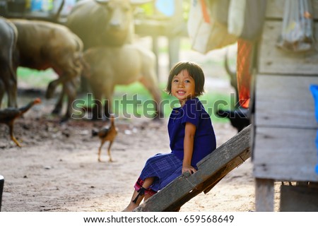 smiling face of a little girl in country asia.             