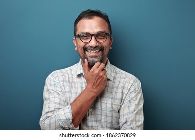 Smiling face of a man of Indian origin