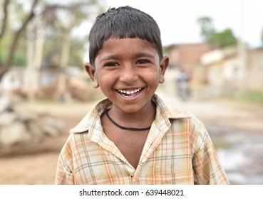 Smiling face portrait of a young child or young boy from rural part of India