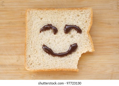 The smiling faces painted on the bread