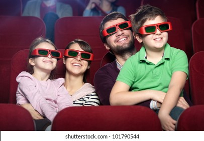 Smiling Family In The 3D Movie Theater