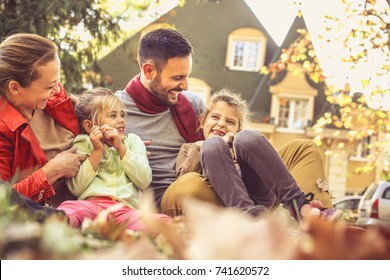 Smiling Family Have Fun At Backyard. 