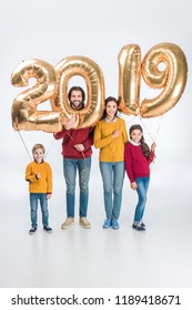 Smiling Family Holding Sign 2019 Made Of Golden Balloons For New Year Isolated On White Background 