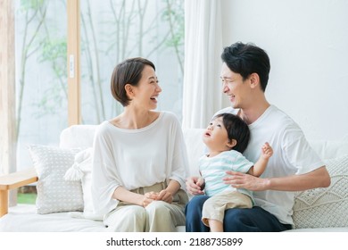 Smiling family in the living room - Shutterstock ID 2188735899