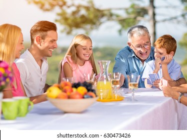 Smiling Family Playing Card Game
