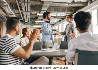 Smiling Female Boss Leader Shaking Hand Of New Team Member Recruiting Him For Job On Staff Briefin