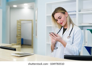 Smiling Female Doctor Use The Cell Phone, Concept Of Medical Worker