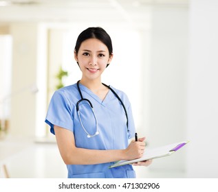 smiling female doctors working in the office