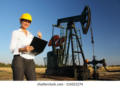 Smiling Female Engineer In An Oilfield