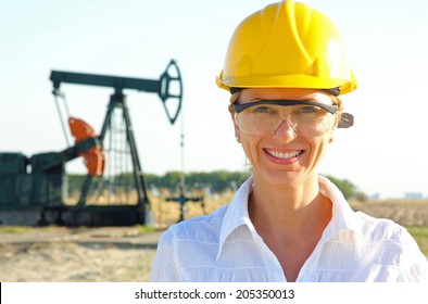 Smiling Female Engineer in an Oilfield