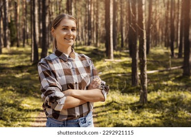 smiling female forester or forest owner. forestry and forest management