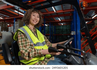 Smiling female forklift driver in a high-visibility vest operating a forklift in a brightly lit warehouse, showcasing workplace positivity. - Powered by Shutterstock