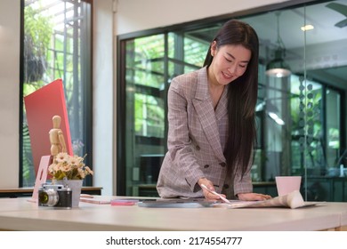 Smiling Female Graphic Designer Working On Nee Project At Creative Office.