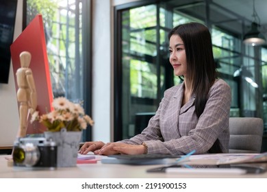 Smiling Female Graphic Designer Working With New Startup Project In Modern Office.