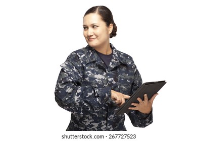 Smiling Female Navy Sailor With Digital Tablet And Looking Away Against White Background