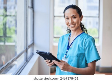 Smiling Female Nurse with Tablet in a Hospital Setting - Powered by Shutterstock