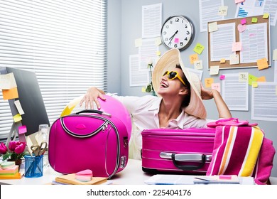 Smiling Female Office Worker Ready To Leave For Vacations With Pink Luggage.
