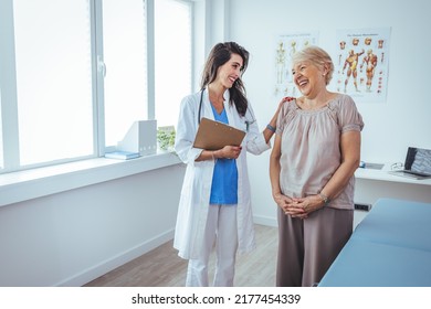 Smiling female patient at consultation with woman doctor. Patient Having Consultation With Doctor In Office. Cropped shot of a medical practitioner reassuring a patient - Shutterstock ID 2177454339