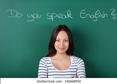 Smiling Female Student In Classroom Learning English