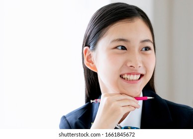 A smiling female student studying