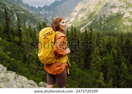 Similar – Image, Stock Photo Hiking in mountains. Mountain landscape. Scenic view of mountain peaks. Panoramic view. Natural scenery. Beautiful background