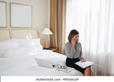 Smiling Filipina Business Lady Working In Hotel Room