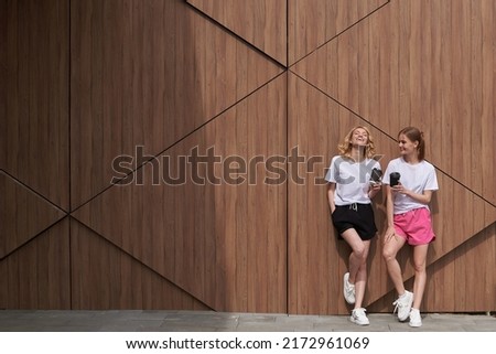 Similar – Couple of tourists walking down the street