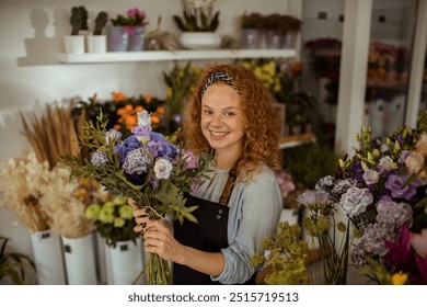 Smiling florist holding bouquet in flower shop - Powered by Shutterstock