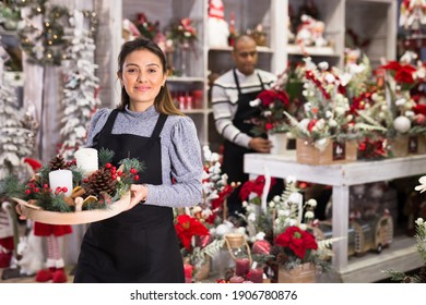 Smiling Flower Shop Worker Making Christmas Compositions