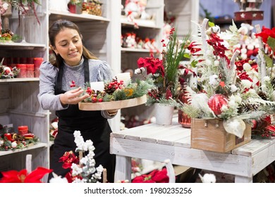 Smiling Flower Shop Worker Making Christmas Compositions