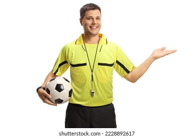 Smiling football referee showing with hand and holding a ball isolated on white background