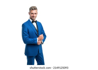 smiling formal man in blue tuxedo bowtie isolated on white background