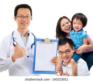 Smiling Friendly Chinese Male Medical Doctor And Young Patient Family. Health Care Concept. Isolated On White Background.