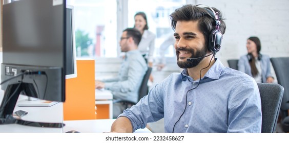 Smiling friendly helpline technical support operator in call centre. - Powered by Shutterstock