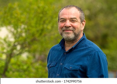 Smiling Friendly Unshaven Adult Man Outdoors Portrait