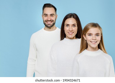 Smiling Funny Young Happy Parents Mom Dad With Child Kid Daughter Teen Girl In Basic White Sweaters Looking Camera Isolated On Blue Background Studio Portrait. Family Day Parenthood Childhood Concept