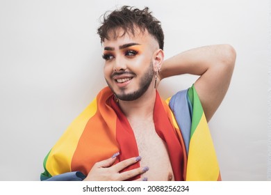 A Smiling Gay Boy With Makeup With An LGBT Flag On His Shoulder On A White Background.
Diversity Concept