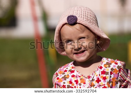 Similar – small girl wearing a hat singing happily