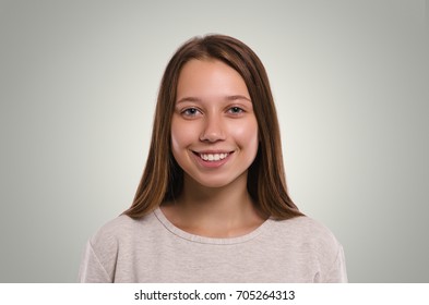 Smiling girl. Attractive young girl portrait. Beautiful  female looking at camera. Healthy woman studio portrait. 
