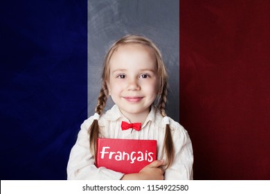 Smiling Girl With Book Against French Flag Banner. Learning French